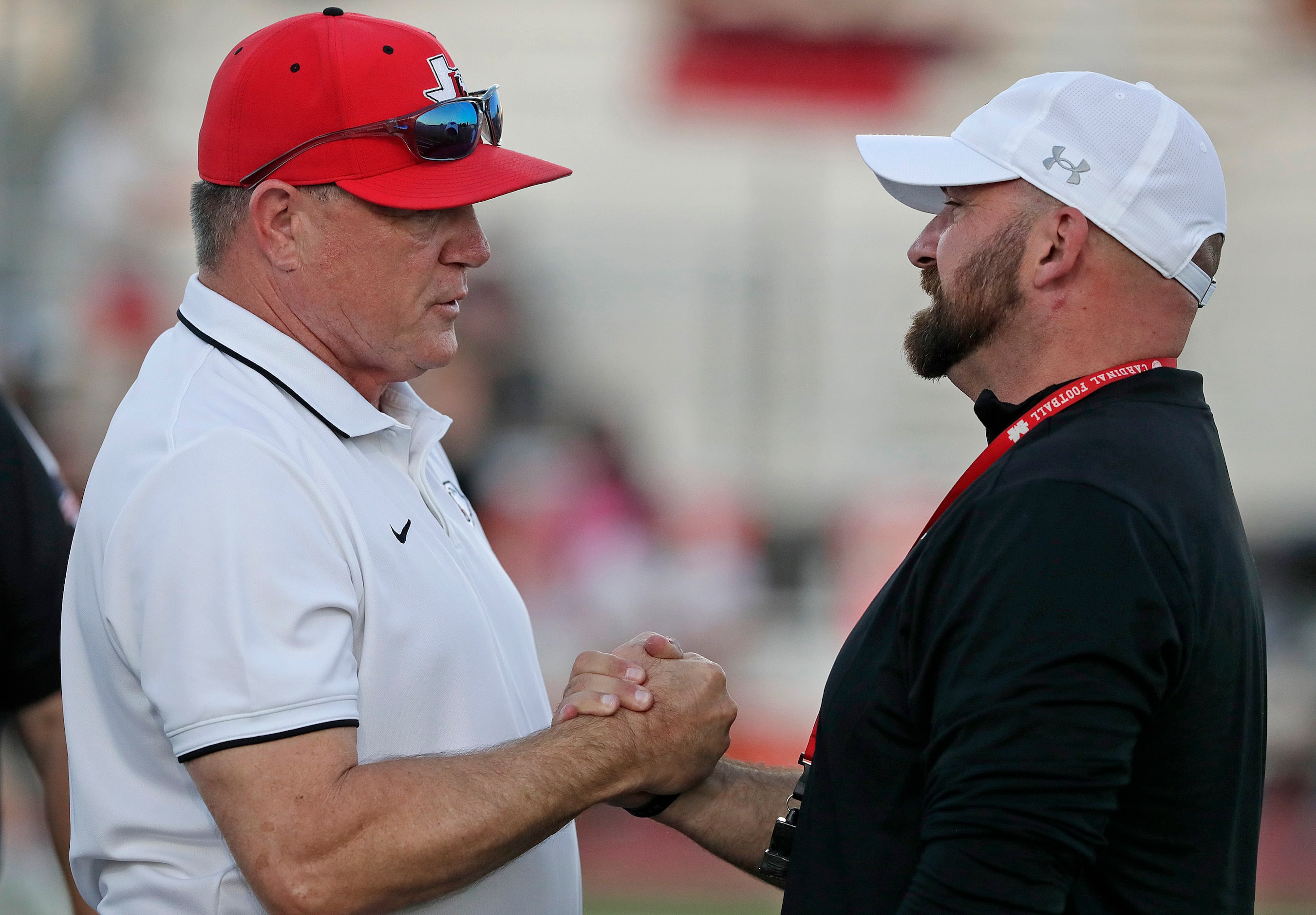 Lovejoy High School head coach Todd Dodge greets Melissa High School head coach Matthew...