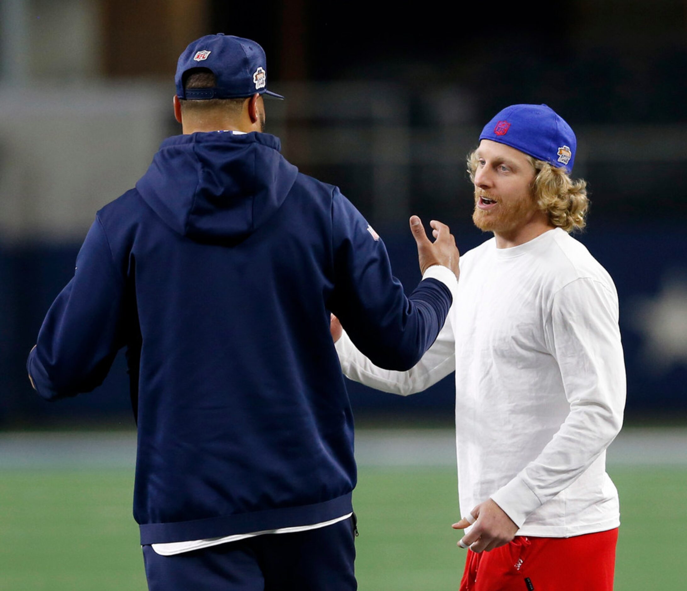 Buffalo Bills wide receiver Cole Beasley (10) talks with Dallas Cowboys quarterback Dak...