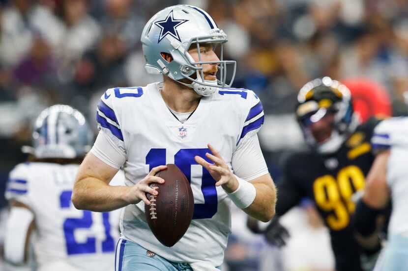 Dallas Cowboys quarterback Cooper Rush (10) looks to pass during a play in the first quarter...