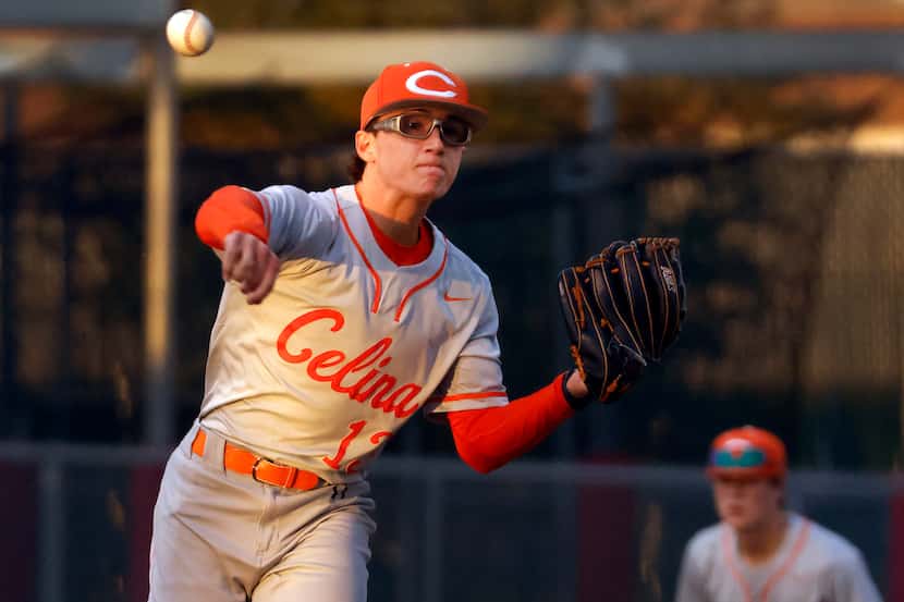 Celina High starting pitcher Brady Broeckel (13) wheels and throws to first on a third...