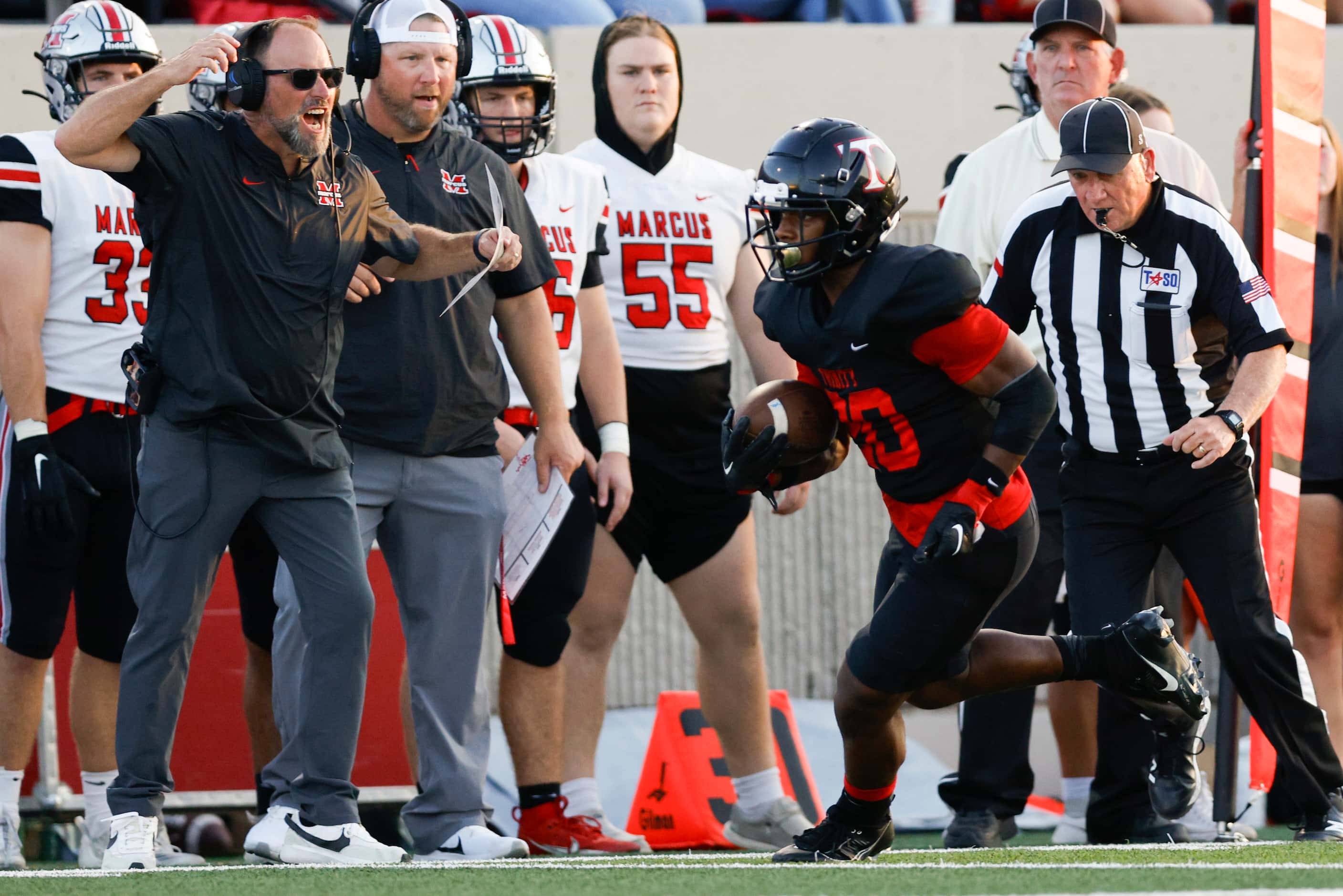 Euless Trinity running back Josh Bell (20) races down the sideline for a touchdown during...