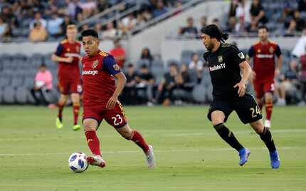 Real Salt Lake midfielder Sebastian Saucedo (23) controls the ball next to Los Angeles FC...