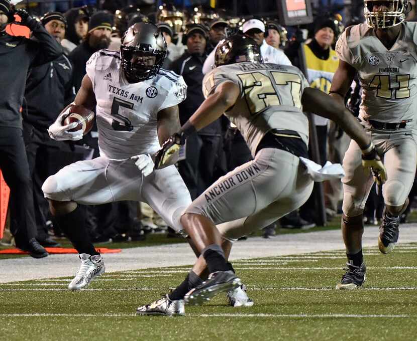 NASHVILLE, TN - NOVEMBER 21:  Running back Tra Carson #5 of the Texas A&M Aggies rushes...