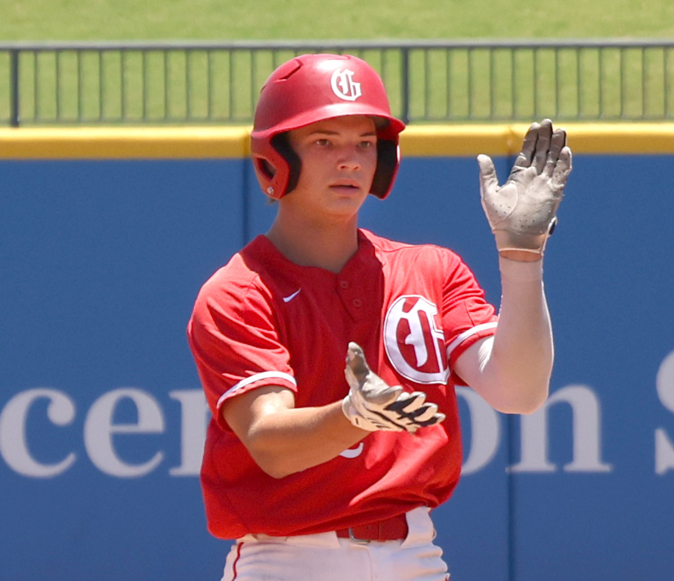 Grapevine first baseman Jarett Boswell (12) reacts after reaching second base on an RBI...