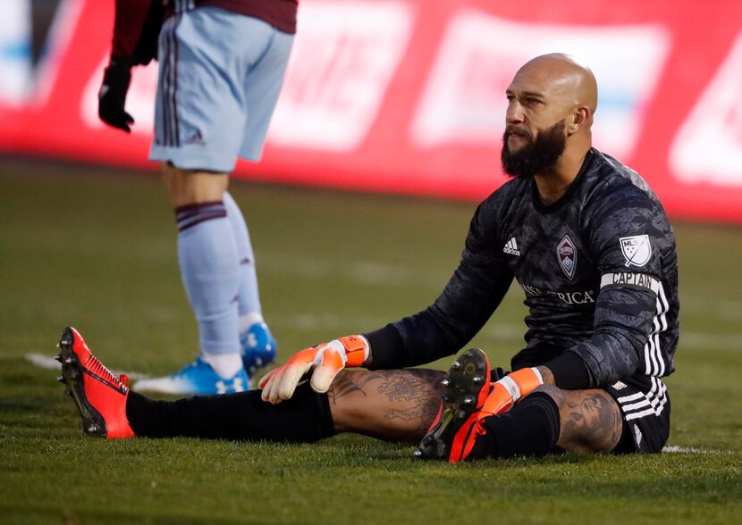 Colorado Rapids goalkeeper Tim Howard sits on the pitch after giving up a goal to the...