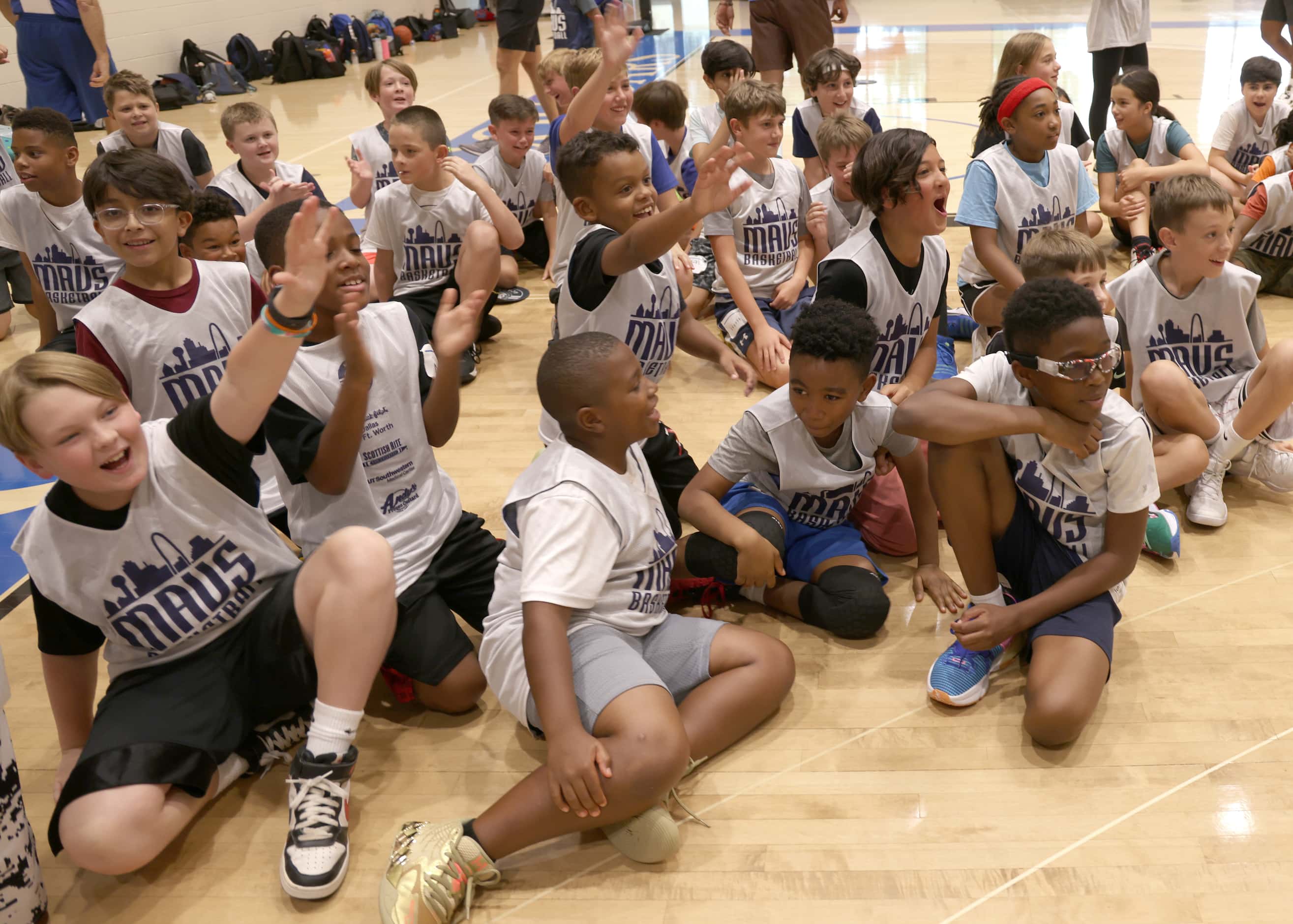 Mavs Hoop Camp attendees show their excitement upon the arrival of Dallas Mavericks forward...