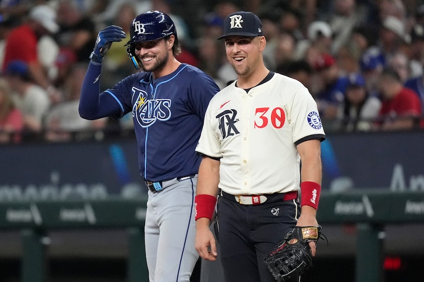 Texas Rangers first baseman Nathaniel Lowe (30) and his brother Tampa Bay Rays' Josh Lowe,...