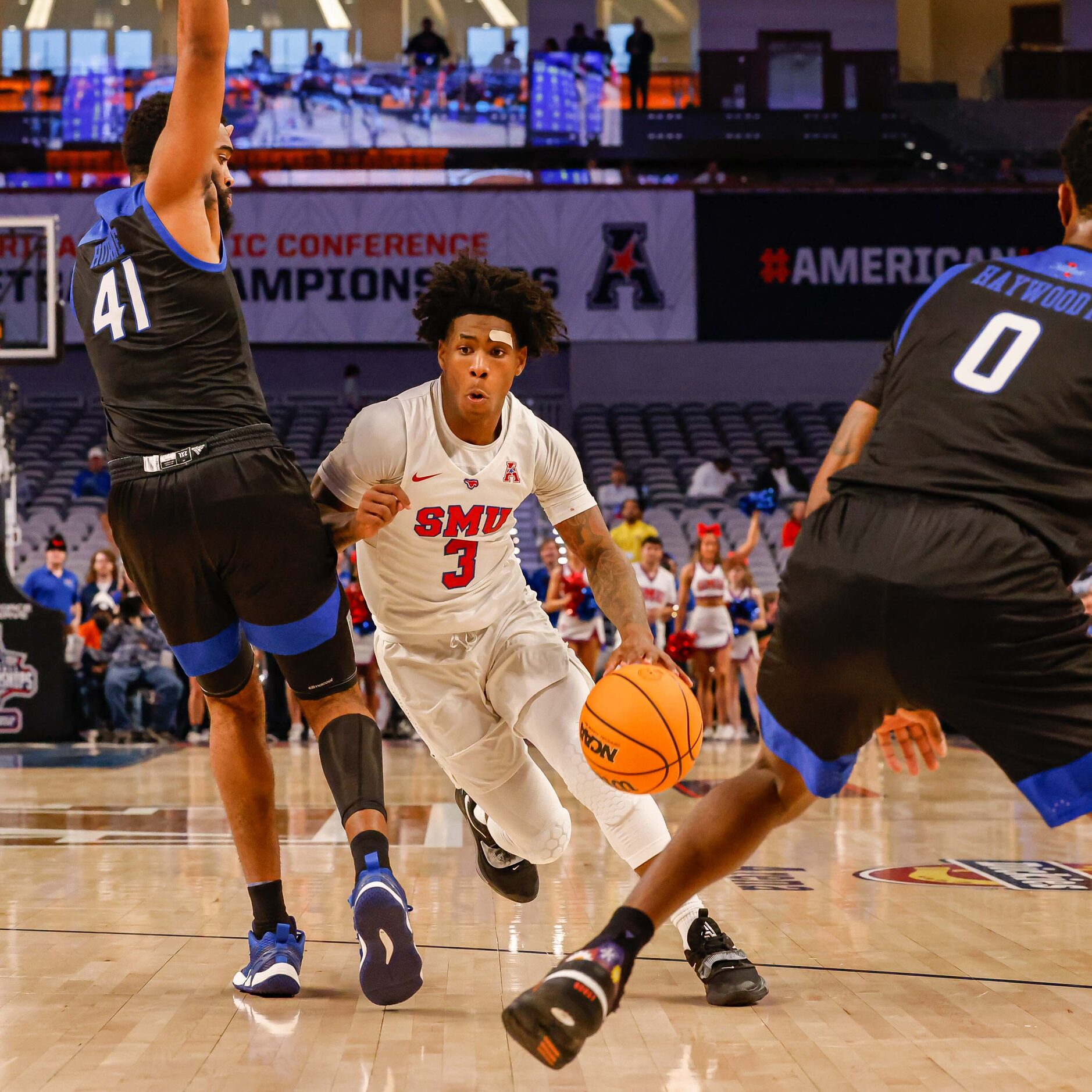 Southern Methodist Mustangs guard Kendric Davis (3) goes between Tulsa Golden Hurricane...