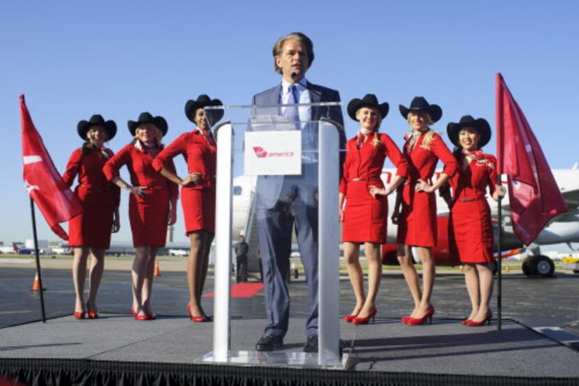 
Virgin America CEO David Cush (center) announces Friday that the airline is beginning to...