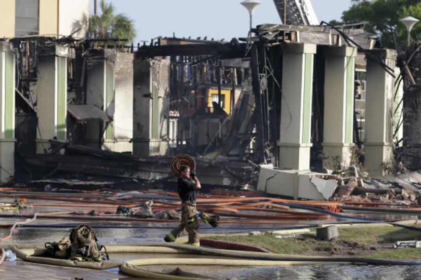 Investigators probing the cause of the five-alarm May 31 blaze that left four Houston...