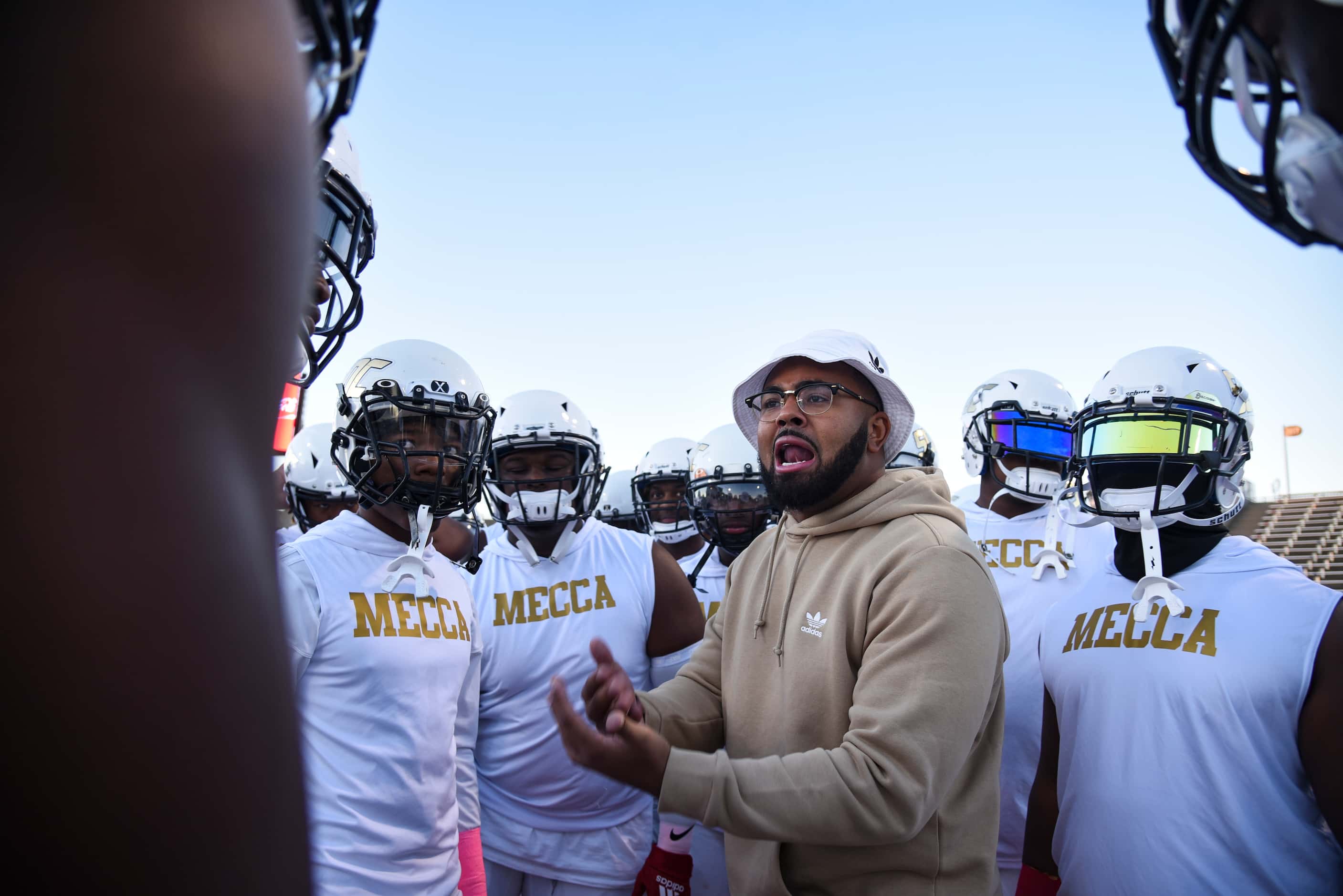 South Oak Cliff Linebackers Coach Domenic Spencer gets his players fired up before the start...