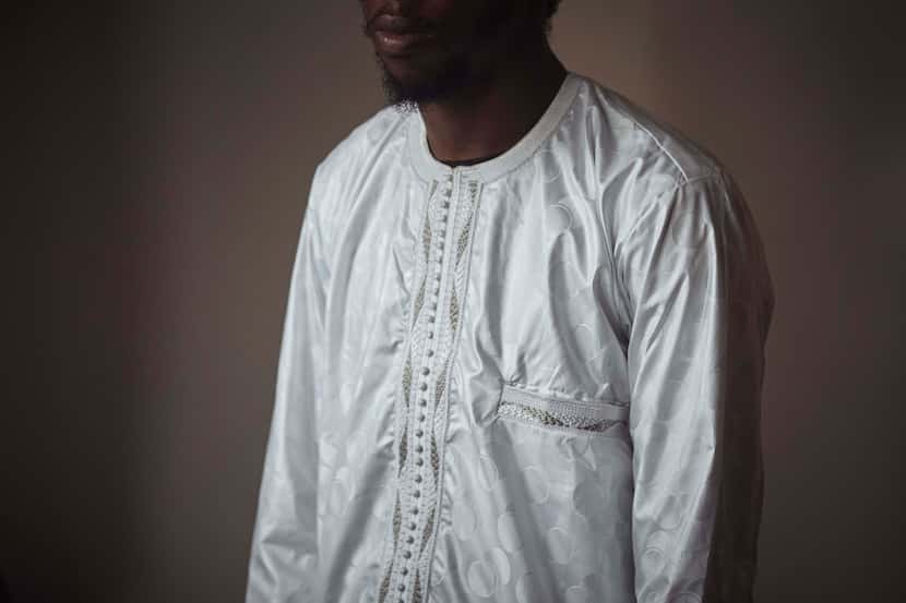 Abdoul, 32 year-old migrant from Maghama, Mauritania poses for a photograph at his shared...