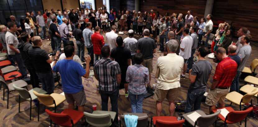 Over 100 employees of Watermark Community Church attend a weekly staff prayer meeting.
