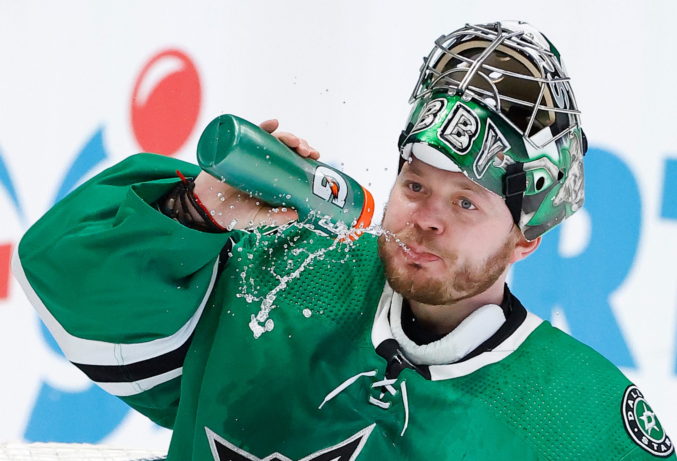 Dallas Stars goaltender Anton Khudobin (35) takes a squirt of water after being scored on in...