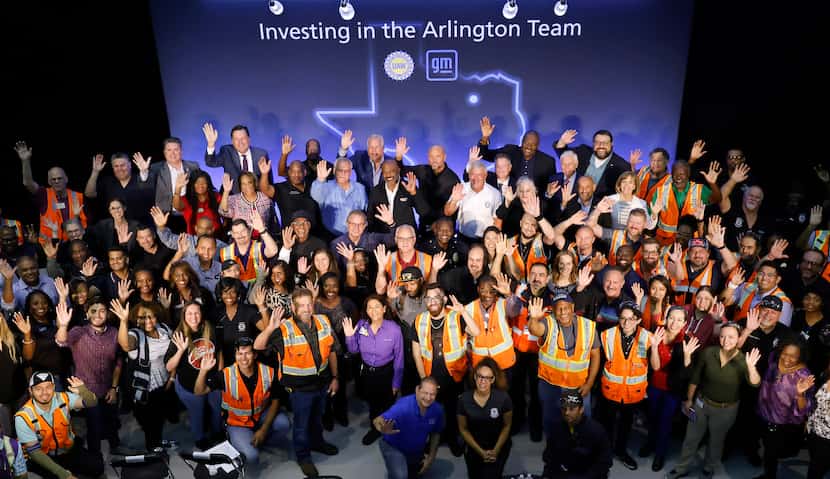 General Motors Co. employees and local officials gathered for a group photo following the...