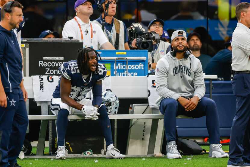 Dallas Cowboys quarterback Dak Prescott (4) checks a play next to Dallas Cowboys wide...