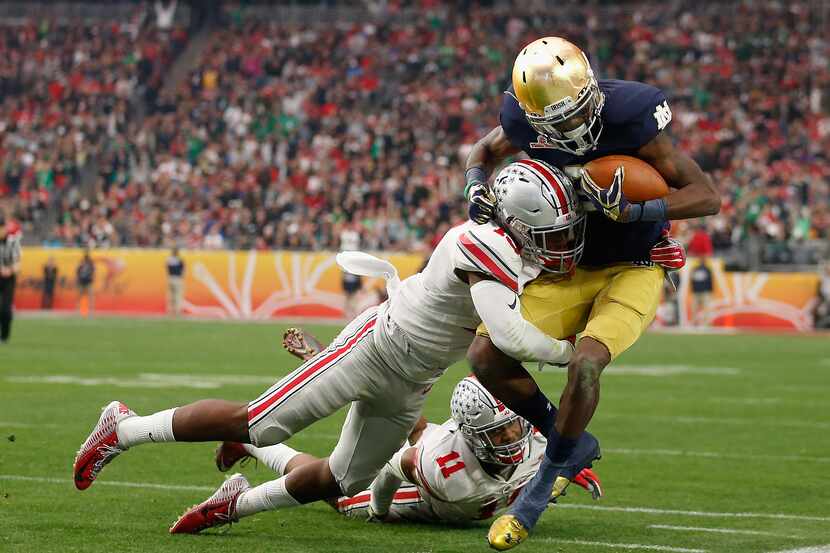 Wide receiver Chris Brown #2 of the Notre Dame Fighting Irish runs with the football against...