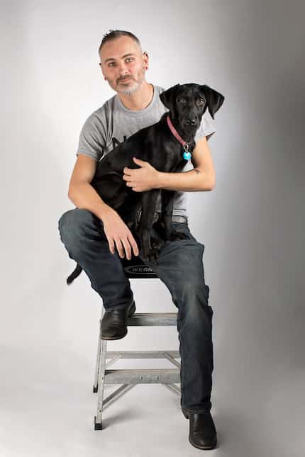 Michael Wright, 33, with his service dog, Liberty. Liberty helps Wright with post-traumatic...