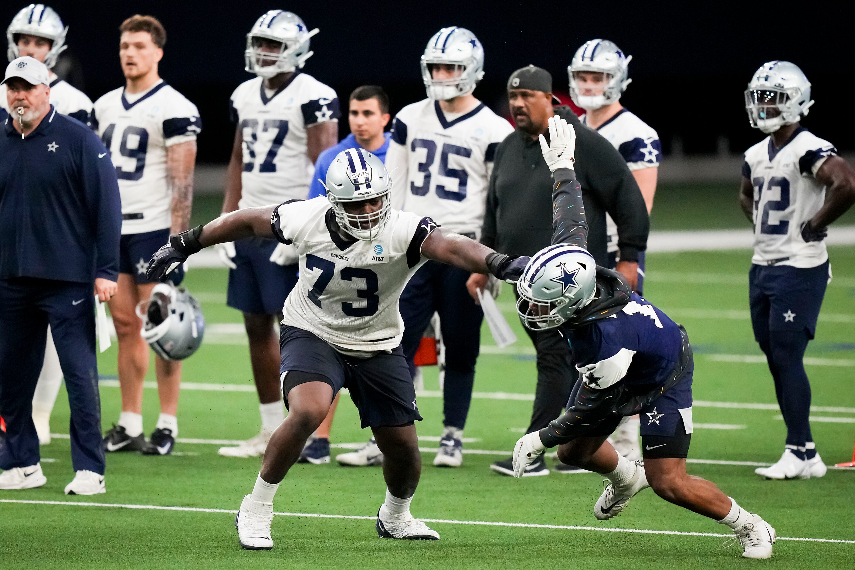 Dallas Cowboys offensive lineman Tyler Smith (73) works against linebacker Micah Parsons...