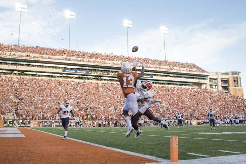 AUSTIN, TX - SEPTEMBER 10:  Jerrod Heard #13 of the Texas Longhorns catches a 29 yard...