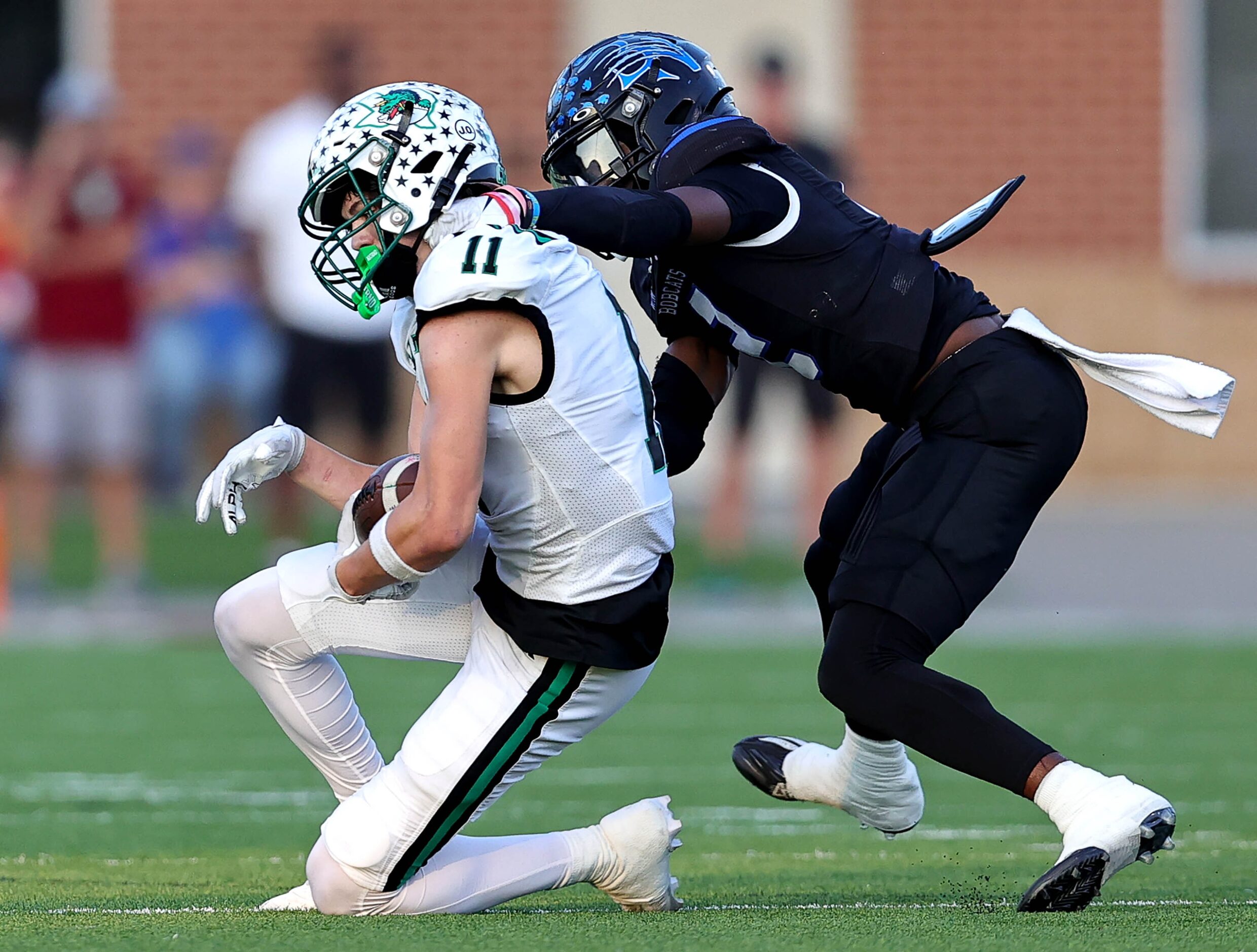 Southlake Carroll wide receiver Brock Boyd (11) makes a reception against Byron Nelson...