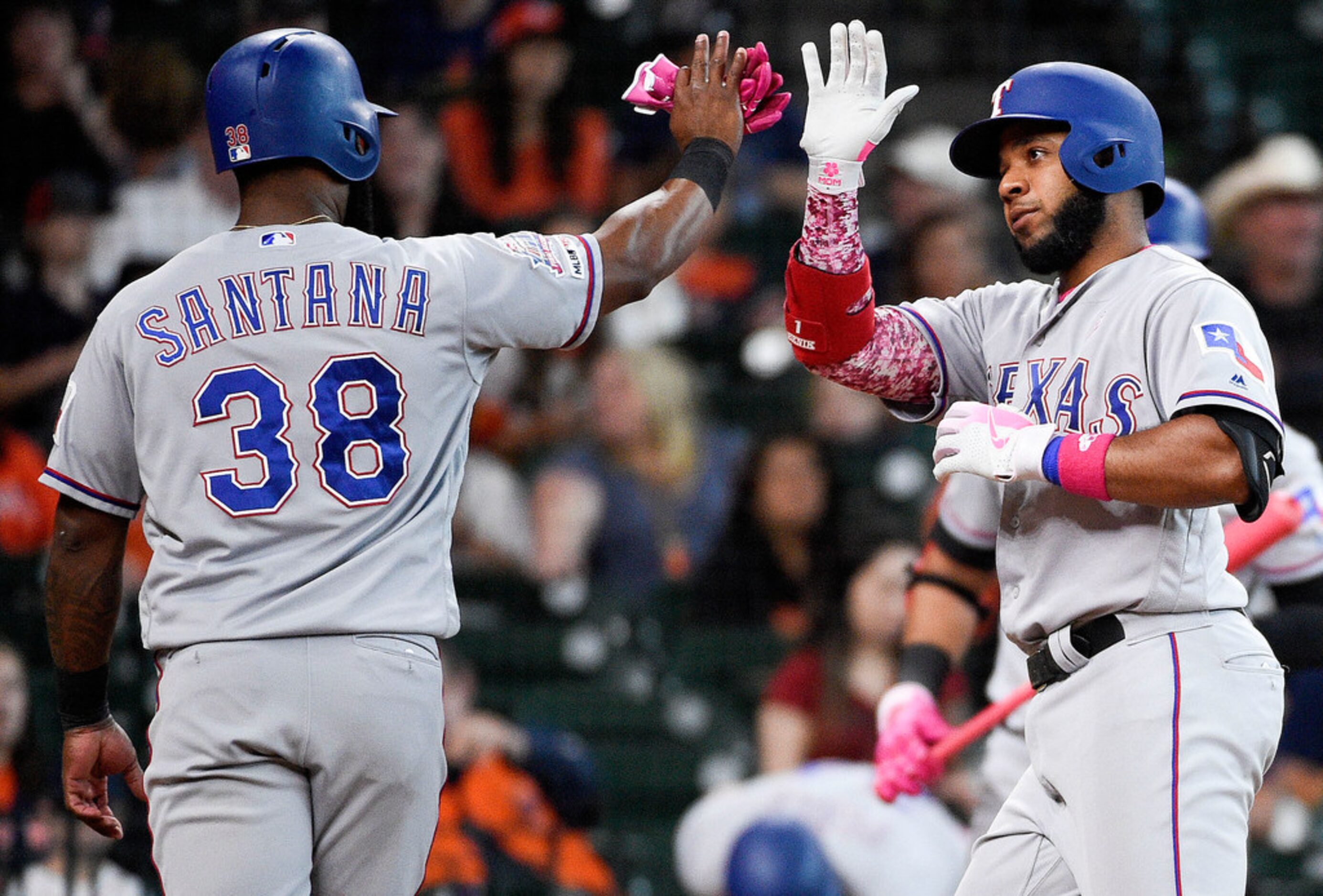 Texas Rangers' Elvis Andrus, right, celebrates his two-run home run off Houston Astros...