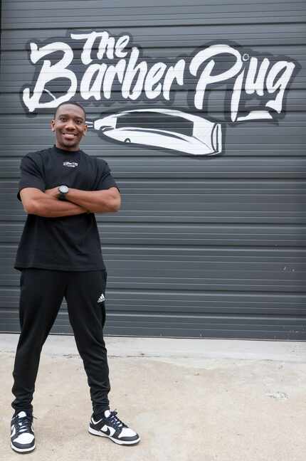 Owner Devante Sanders outside his Barber Plug Supply Co. store in West Dallas. His logo was...