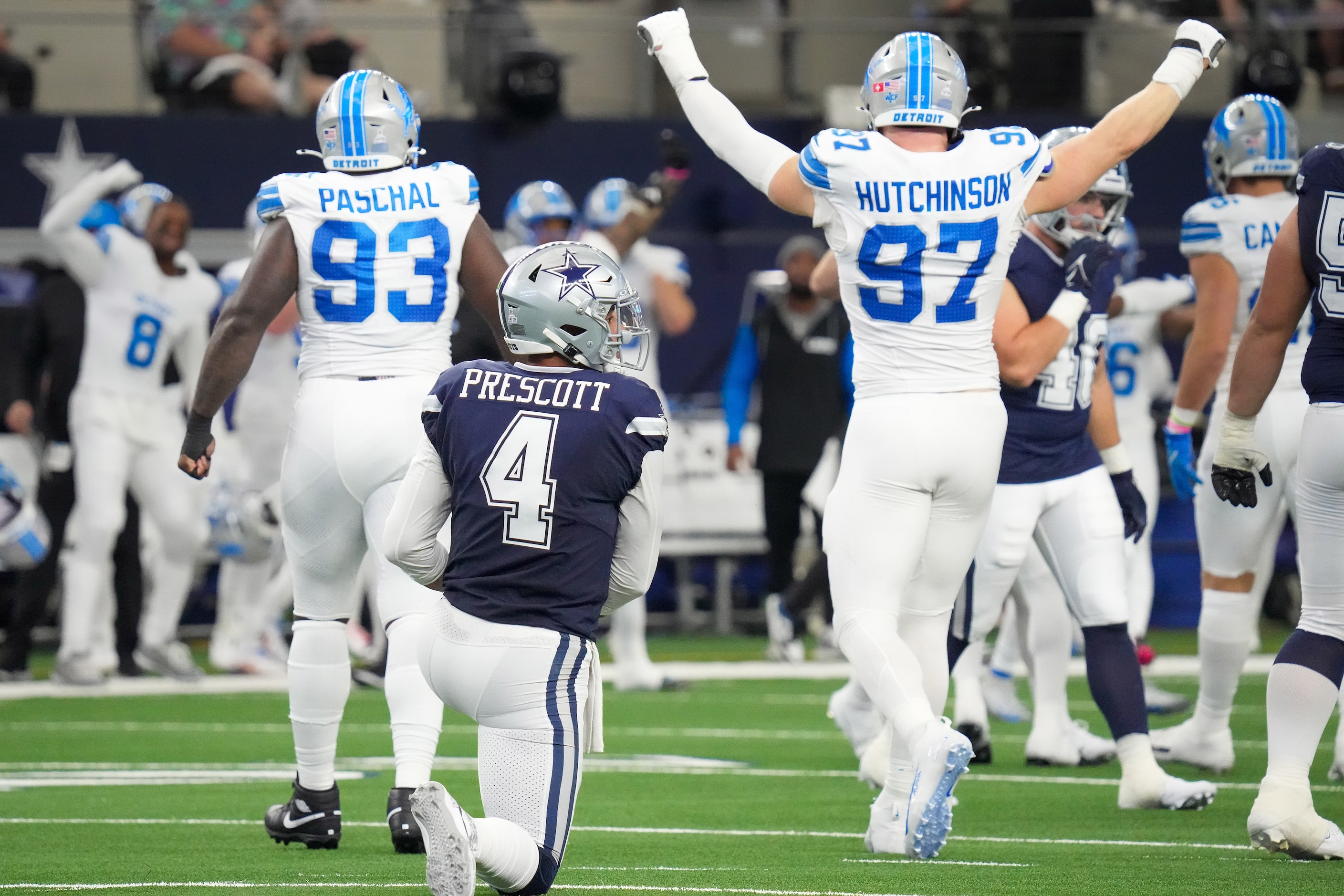 Dallas Cowboys quarterback Dak Prescott (4) gets up from the turf as Detroit Lions defensive...