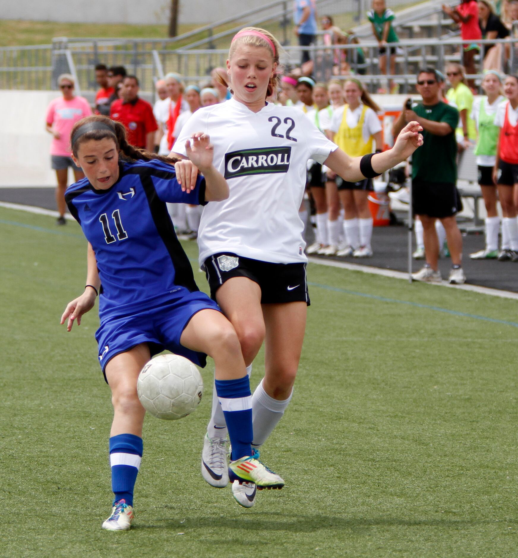 Hebron freshman forward Gabby Duca (11) fights for possession of the ball against Southlake...