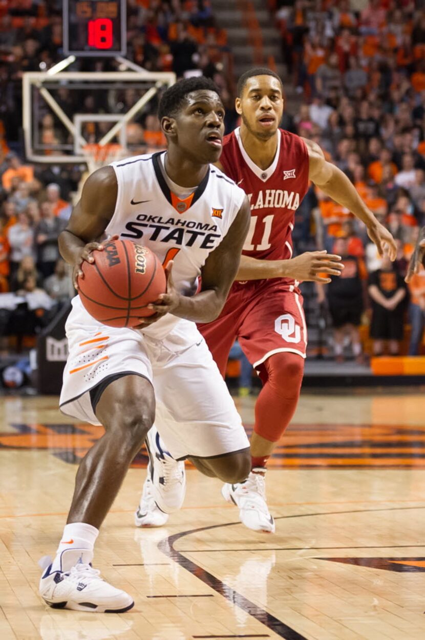 Jan 13, 2016; Stillwater, OK, USA; Oklahoma State Cowboys guard Jawun Evans (1) drives to...