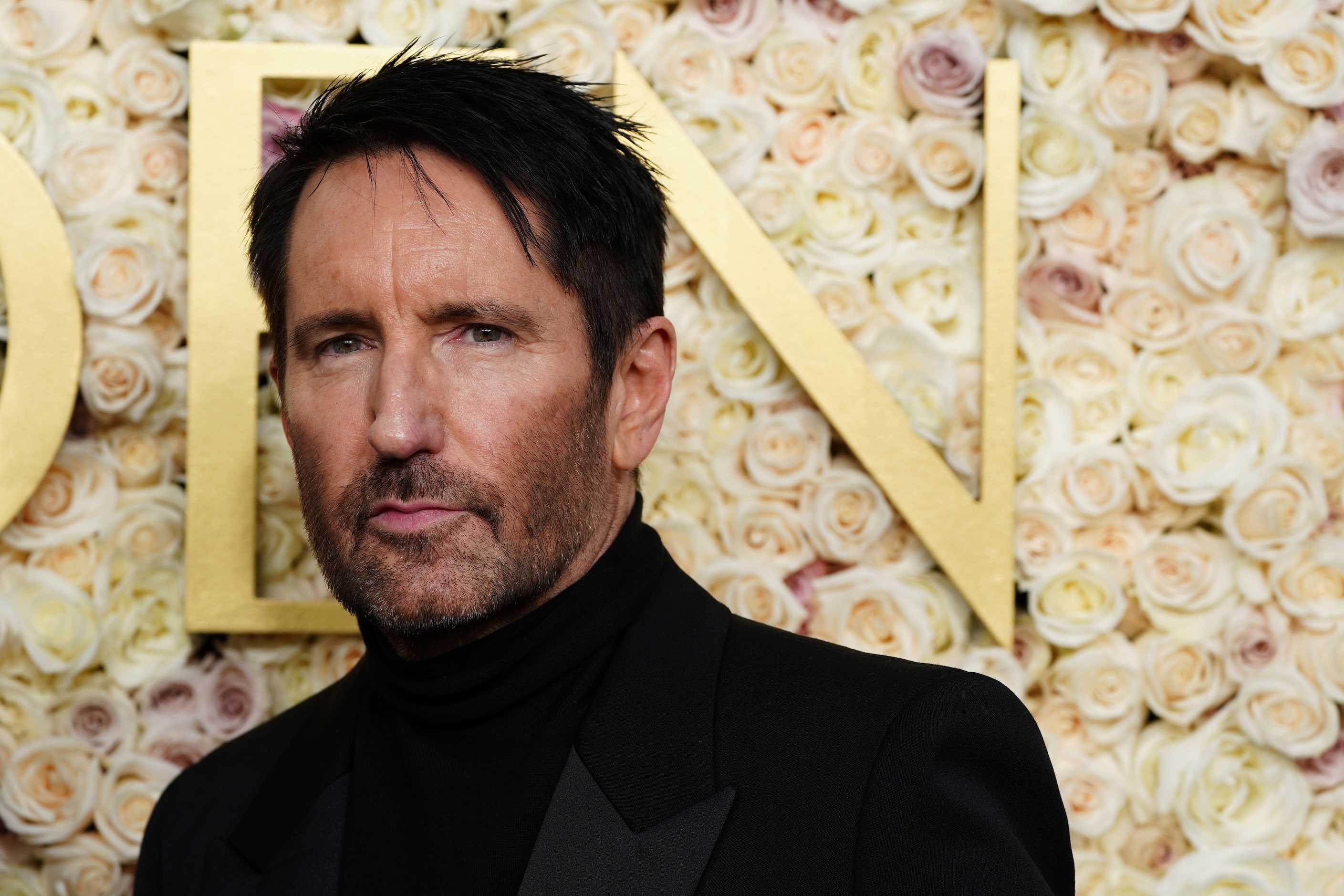 Trent Reznor arrives at the 82nd Golden Globes on Sunday, Jan. 5, 2025, at the Beverly...