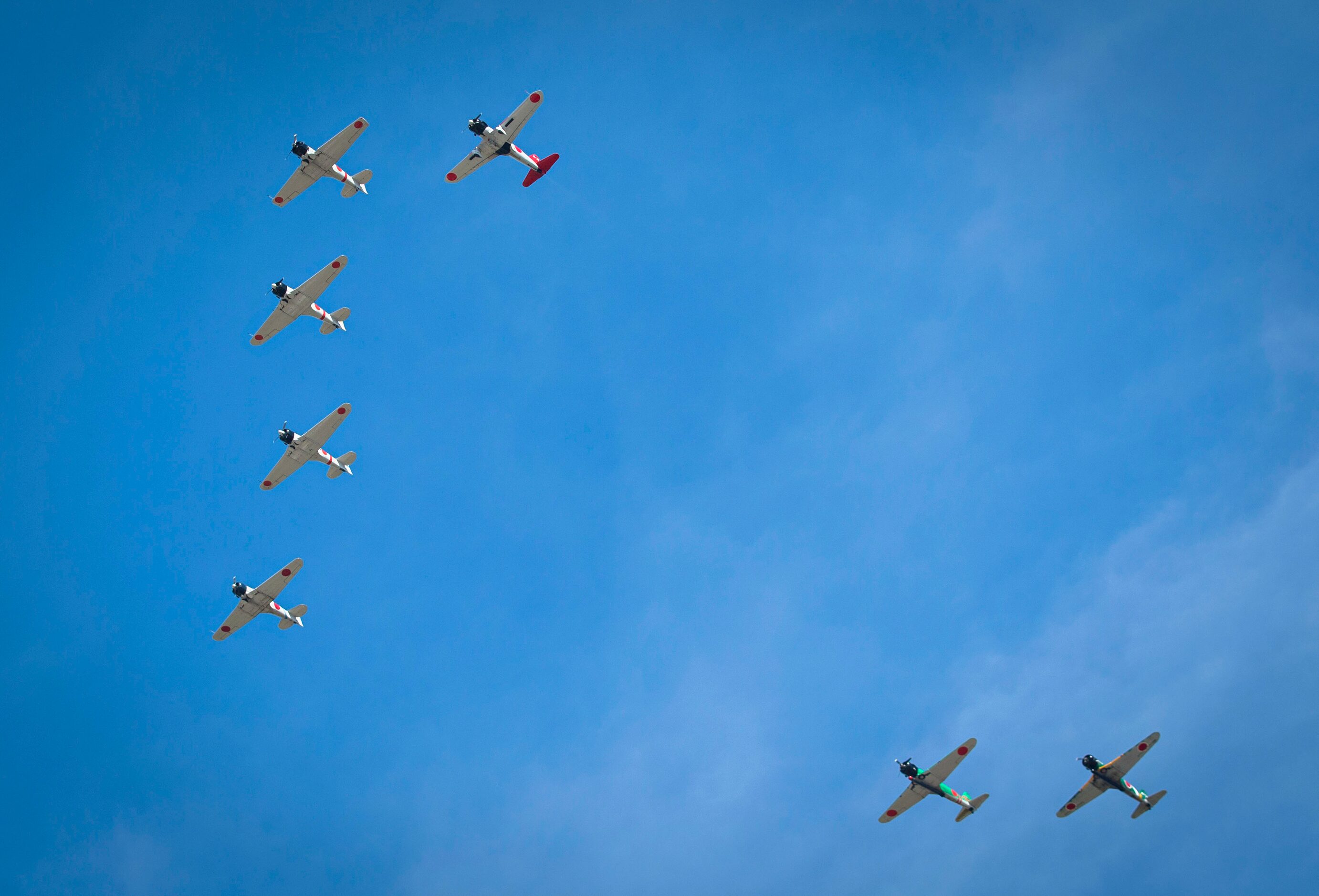 Japanese Zero airplanes fly overhead during the Commemorative Air Force Wings Over Dallas...