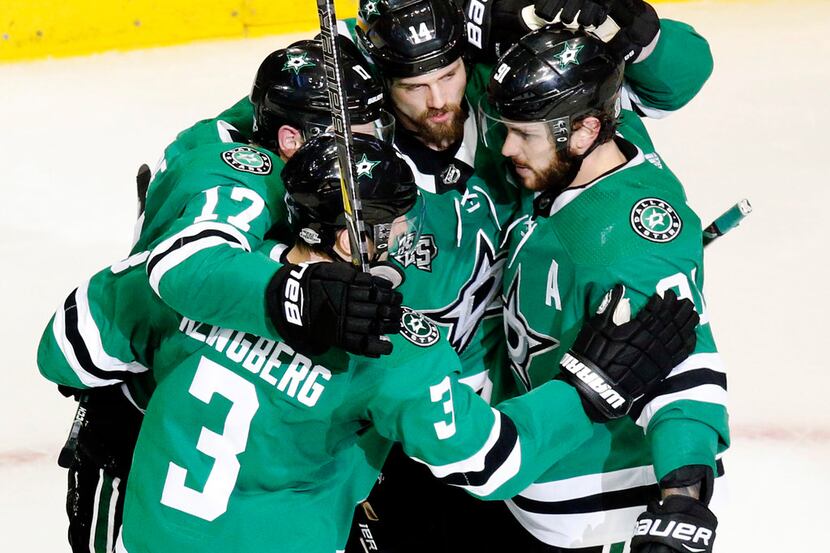 In a February 3, 2018, file image, the Dallas Stars' Jamie Benn (14) is congratulated on a...