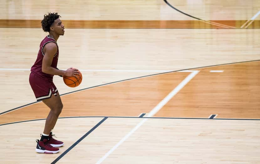 Keller Central's Latrell Jossell (4) sets up for a penalty shot  during the first half of a...