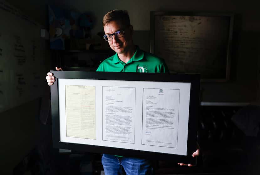Executive Director of OurCalling Wayne Walker poses with a citation from the City of Dallas,...