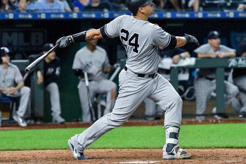 New York Yankees' Gary Sanchez follows through on a solo home run in the ninth inning during...