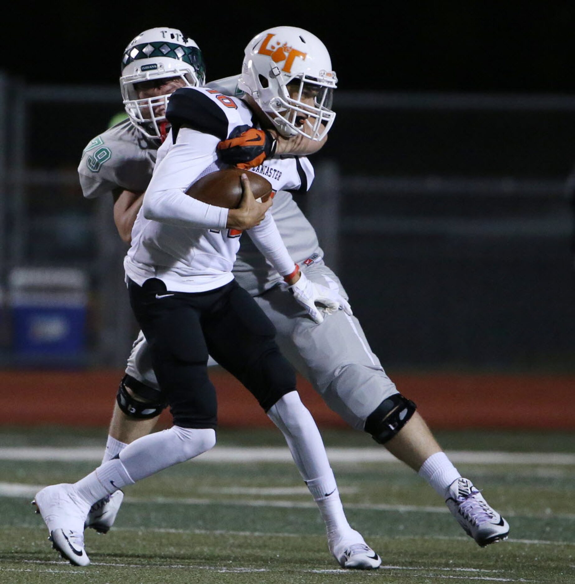 Waxahachie defensive lineman Trevor Thielen (79) sacks Lancaster quarterback Ryan Ross (1)...