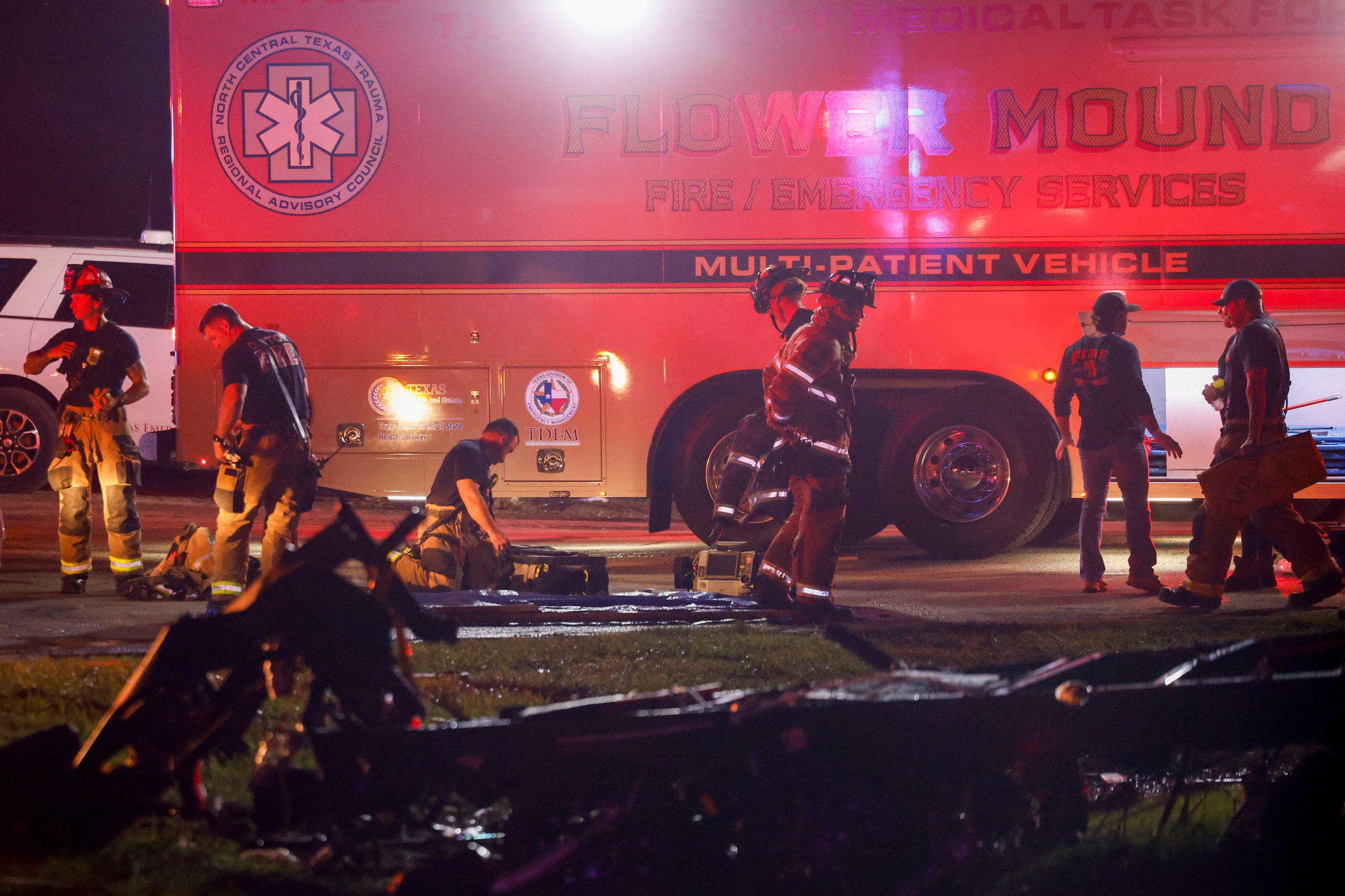 Firefighters work the scene of a Shell gas station after a suspected tornado moved through...