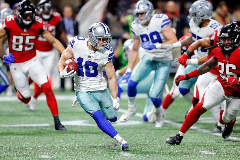 Dallas Cowboys wide receiver Ryan Switzer (10) cuts back across the field as he returns a...