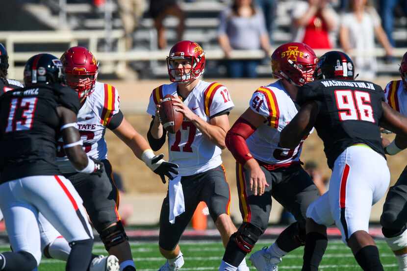 LUBBOCK, TX - OCTOBER 21: Kyle Kempt #17 of the Iowa State Cyclones looks to pass during the...
