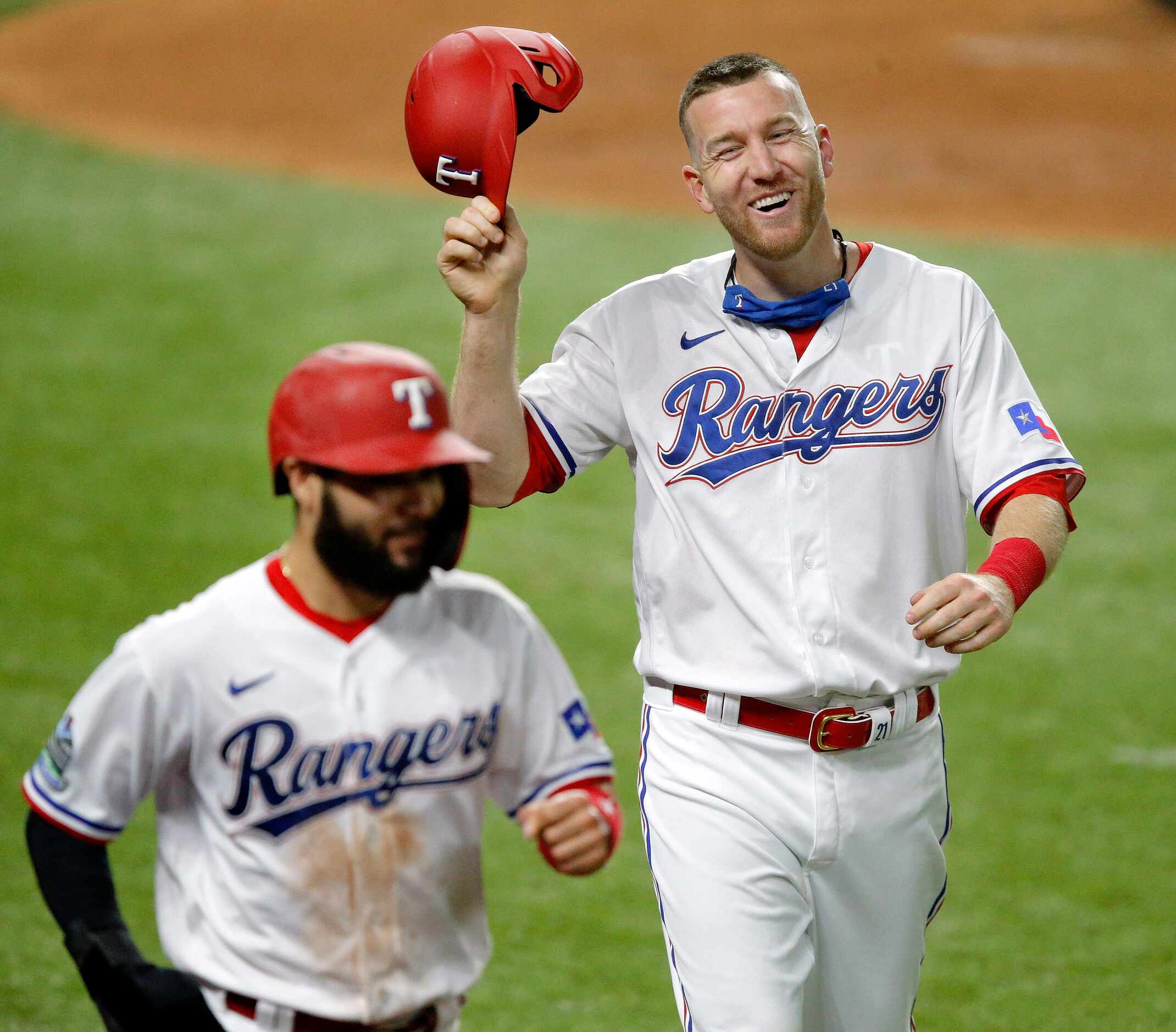 Texas Rangers Todd Frazier (right) scores with Isiah Kiner-Falefa on a single by Nick Solak...