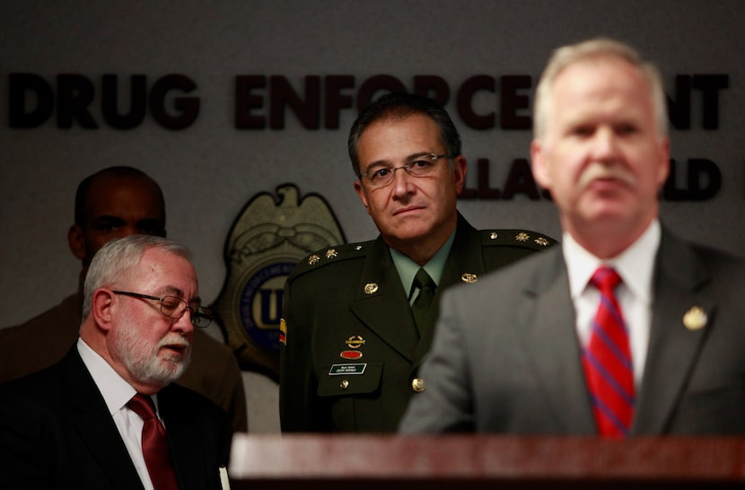 General Oscar Naranjo (background center), the director of Directorate of Criminal...