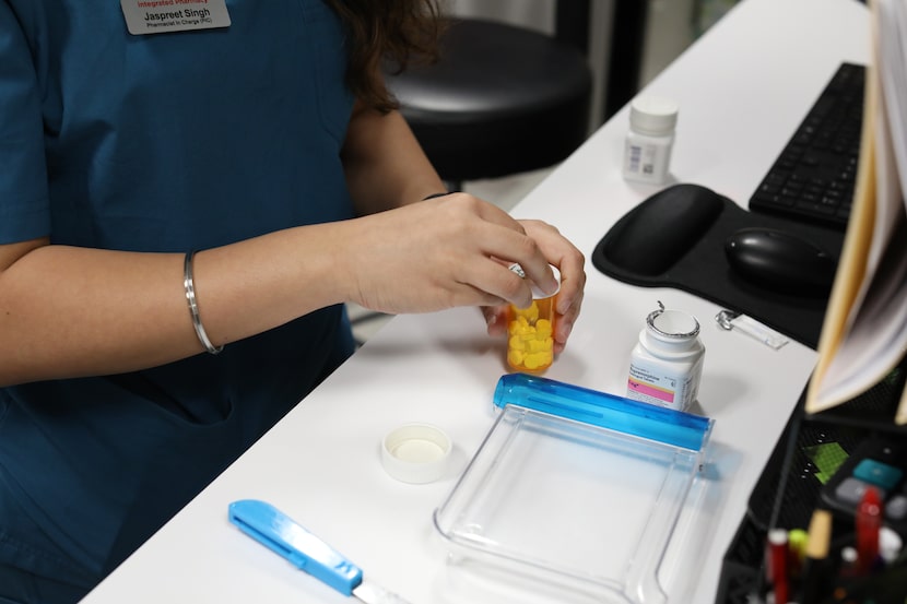 Jaspreet Singh prepares buprenorphine at Integrated Pharmacy in Plano on Sept. 22, 2023.