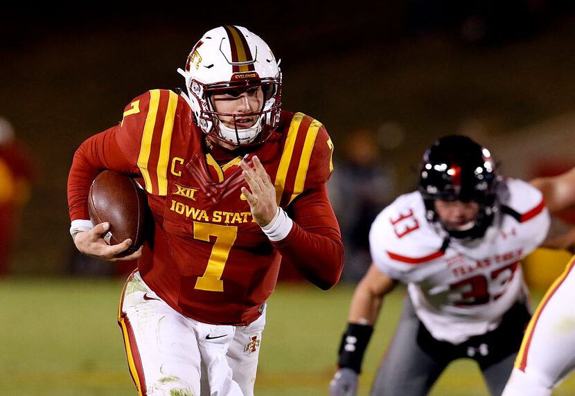 AMES, IA - NOVEMBER 19: Quarterback Joel Lanning #7 of the Iowa State Cyclones scrambles for...