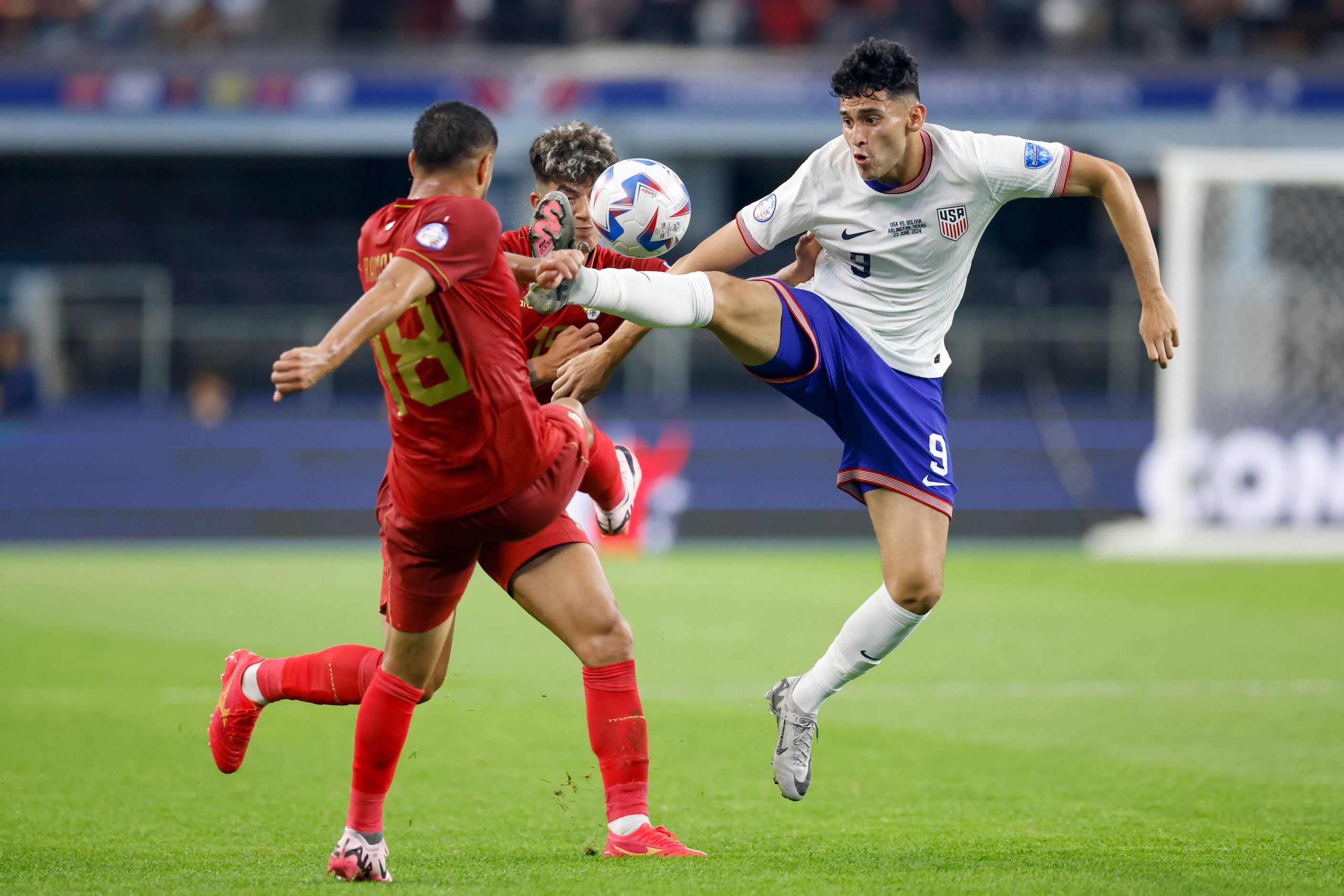 United States forward Ricardo Pepi (9) jumps to control the ball ahead of Bolivia forward...