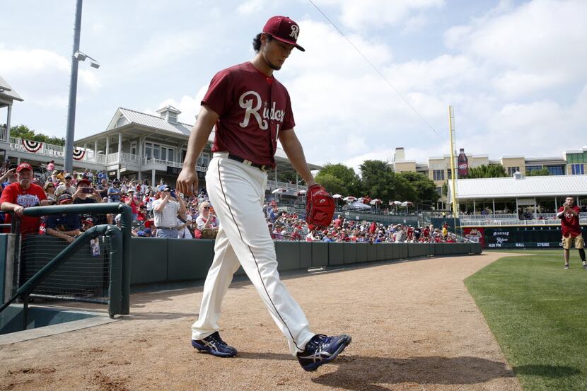Yu Darvishenters the field the first inning during the Frisco RoughRiders  game against the...