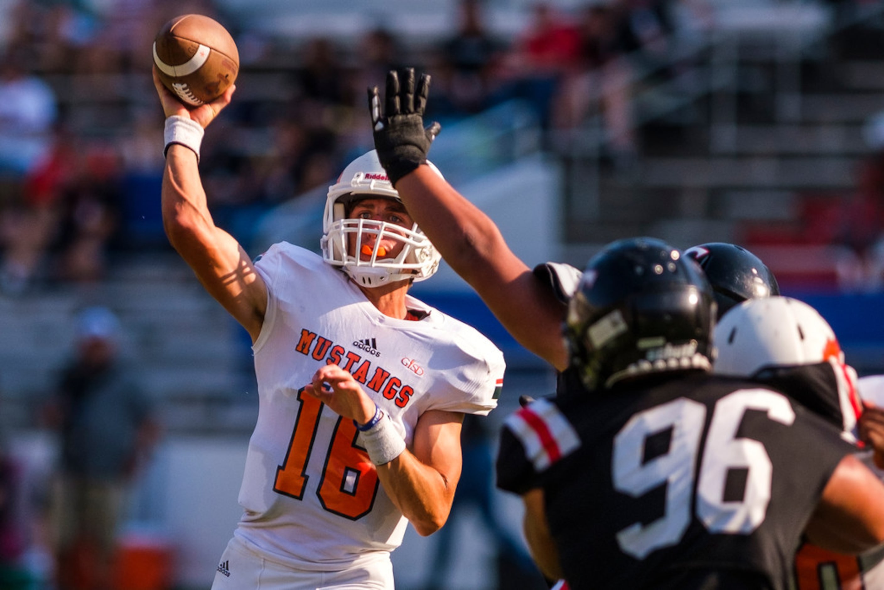 Sachse quarterback Parker Wells (16) throws a pass during the first half of a high school...