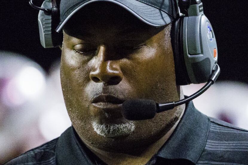 Skyline head coach Derick Roberson stands on the sidelines during the third quarter of their...