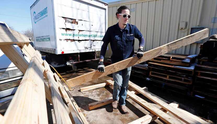 
Jason Whorton prepares the wood at PalletSmart workshop in Fort Worth.
