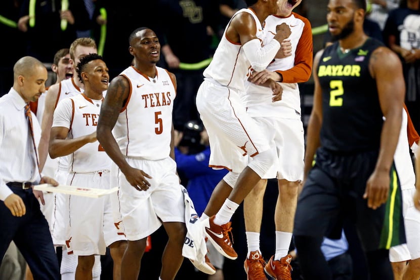 Feb 1, 2016; Waco, TX, USA; Texas Longhorns players celebrate in front of Baylor Bears...